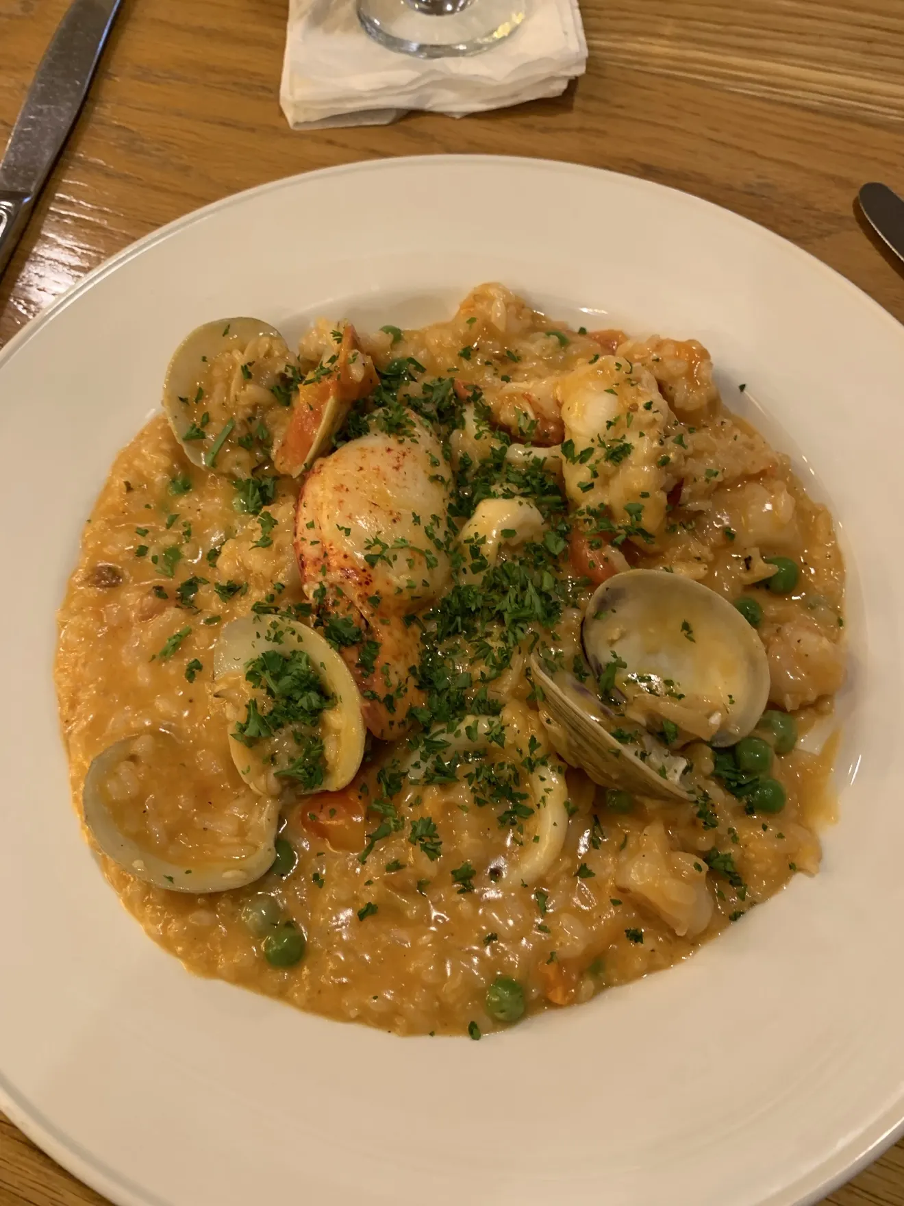 Seafood risotto plated for serving