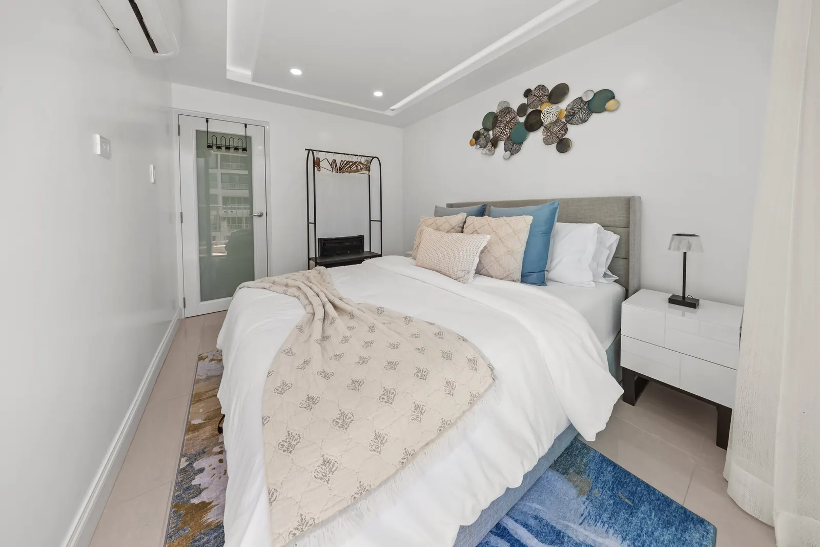 Maréa bedroom with warm coastal styling
